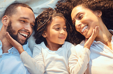 Image showing Love, family and relax in bed with girl bonding with parents, resting and caring in a bedroom together. Care, face and smiling, sleepy child waking up to loving parent, enjoying a morning indoors