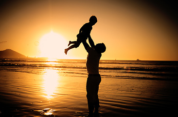 Image showing Beach silhouette, dark sunset and family on travel holiday in Mauritius, happy at the ocean sea and love for child on vacation in summer. Father and kid playing by the water in nature sunshine