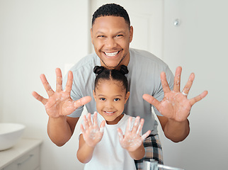 Image showing Black family with soap on hands in bathroom for bacteria cleaning safety, learning or teaching hygiene healthcare portrait. Wellness father showing girl child how to wash germs with foam for skincare