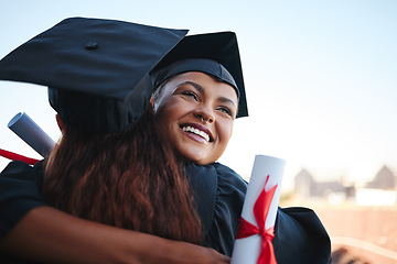 Image showing Success, graduation and friends hug at event in celebration of education achievement. Congratulations, smile and happy students embrace, sharing optimistic moment of friendship at graduate ceremony