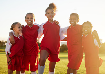 Image showing Girl team, kids group portrait on soccer field and happy girls together. Teamwork, football and diversity, proud female kids from Brazil pose on grass, fun friends and playing football game at sunset