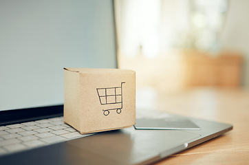 Image showing Online shopping, box and laptop with credit card for payment of product, purchase or service goods. Fintech, cardboard trolley logo and finance bank card for e commerce, cyber retail market and sales