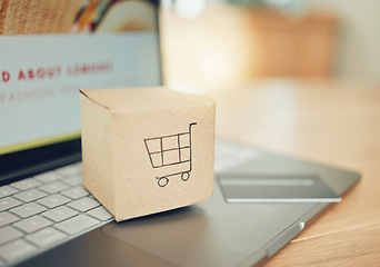 Image showing Online shopping, courier service and credit card for delivery, ecommerce or website stock. Laptop, cardboard box package with digital payment technology, supply chain shipping or product distribution