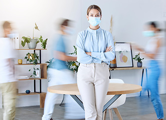 Image showing Covid, office and busy portrait of woman with mask for protection from virus in workplace. Motion blur of business people in professional agency with coronavirus face shield for safety.