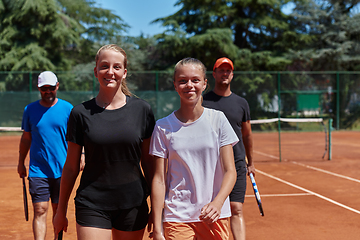 Image showing Tennis club together after hard training, showing their dedication, hard work, and teamwork.