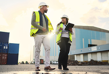 Image showing Logistics, black woman and delivery manager at a warehouse for cargo shipping, inventory and distribution. Collaboration, teamwork and industry worker in a conversation on stock inspection report