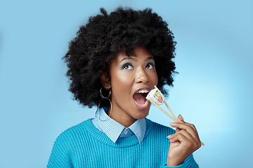 Image showing Sushi, seafood and black woman with smile for seafood from Japan against a blue mockup studio background. African girl eating fish for dinner diet and luxury lunch from restaurant with mock up space