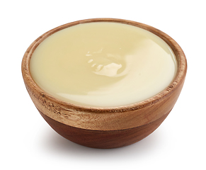 Image showing condensed milk in wooden bowl
