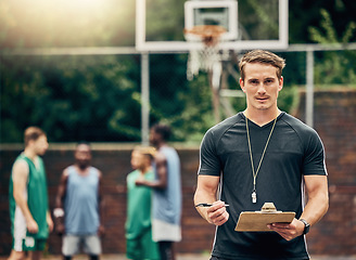 Image showing Basketball coach on court training team for game, tournament and competition outside. Confident, trainer and man focus on workout or teamwork to prepare, motivation and plan play strategy at practice