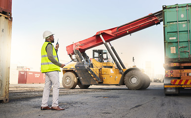 Image showing Truck, radio and forklift in logistics of container at port with man for shipping. Worker, talk and control for safety of stock, staff and vehicle in transportation, cargo and supply chain industry