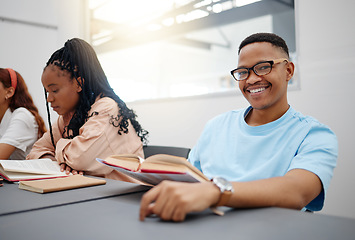 Image showing Reading, books and language student portrait studying in classroom for university education, knowledge and scholarship. College black man in lecture with smile for research, scholarship or learning