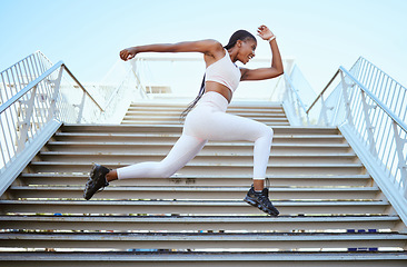 Image showing Energy, running and black woman runner on steps for outdoor fitness training, wellness exercise or sports speed challenge. Strong, healthy power of an african athlete with strength workout motivation