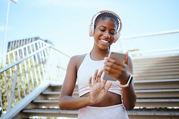 Image showing Fitness, music and headphones with black woman and phone for search, social media or internet. Workout, exercise and health with girl listening to audio, podcast or radio for sports training