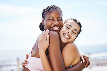 Image showing Women, hug and success after fitness, workout and training by beach, sea or ocean in Miami, Florida. Smile, happy or embrace sports friends in celebration of exercise goals, health target or wellness