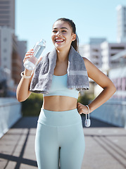 Image showing Fitness, tired and water bottle of woman in urban city portrait happy with workout results or exercise in summer. Wellness young sports, athlete girl drink water after healthy outdoor cardio training