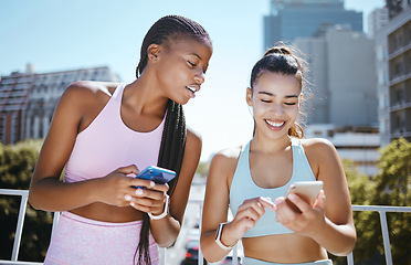 Image showing Friends, phone and laughing during exercise for social media, blog or meme while in city together. Women, smartphone and smile with diversity during training, workout or run in Los Angeles in summer
