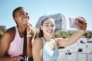 Image showing Phone, exercise and friends taking a selfie after a workout or yoga training session outdoor. Happy smile women enjoying fresh air and fitness, excited and bonding with wellness and health in a city