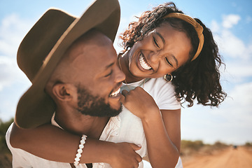 Image showing Happy, love and summer hug of a couple together with quality time in nature. Black people with happiness and a smile embracing travel, summer and the blue sky feeling relationship gratitude outdoor