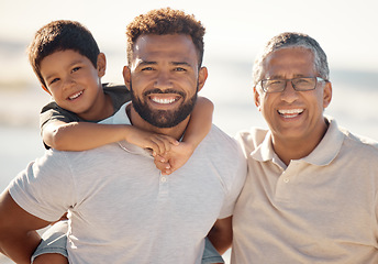 Image showing Happy outdoor adventure, portrait of family on beach in Rio de Janeiro and generations of men travel together. Young boy child on fathers back, dad with smile and proud elderly grandfather vacation