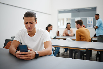 Image showing University man and social media on smartphone in lecture auditorium lesson for internet break. Distracted college student busy with phone text communication on online app in education campus.