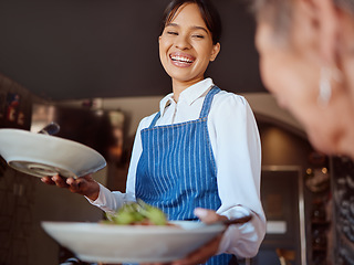 Image showing Waitress in a restaurant, serving customer her food, healthy salad and gives service with a smile. Woman in the hospitality industry, friendly laugh and happy to provide diet meal for lunch or dinner