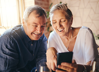 Image showing Happy, love and senior couple on a phone scrolling on social media together in coffee shop. Happiness, smile and elderly man and woman reading a blog on website or browsing the internet on smartphone