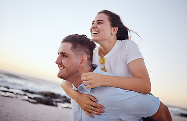 Image showing Happy, couple and piggyback for love on the beach in joyful fun and happiness together in the outdoors. Man and woman enjoying summer vacation at the ocean coast in playful romance in Costa Rica