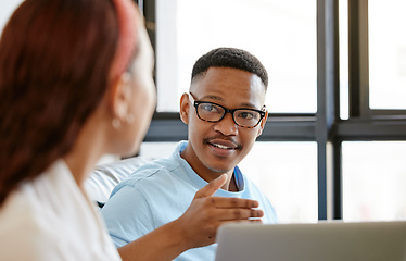 Image showing Black man, designer and creative discussion with staff for ideas, strategy and planning in marketing agency startup. Young african guy talking, speaking and explain colleague, employees and teamwork