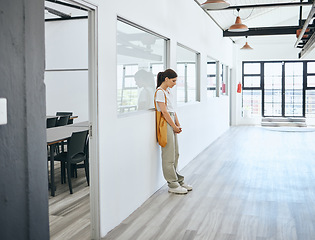 Image showing Depression, stress and woman standing in office upset, sad and disappointed after job loss, fired or mental health problem. Female feeling burnout, anxiety and hopeless looking or waiting for job