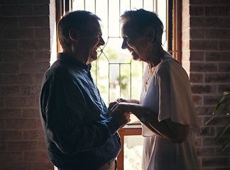 Image showing Love, happy family and senior couple laugh and relax in dark room, bond and share funny joke in their home. Retirement, humour and affection by sweet elderly man and woman smile, enjoy time together