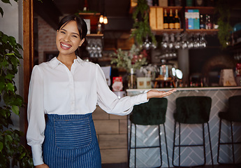 Image showing Welcome, restaurant waiter and business owner giving service with a smile at a coffee shop. Portrait of a black woman working as a waitress at a cafe, coffee shop or small business for fine dining