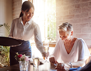 Image showing Restaurant, waitress and senior woman wine tasting for luxury, celebration or fine dining at a vineyard or in hospitality industry. Sommelier service with quality alcohol drink, champagne and glass
