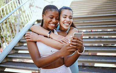 Image showing Selfie, phone and friends after exercise in a city, relax and bonding outdoors together. Fitness, diversity and cheerful women hug and enjoy freedom and fun while taking break from cardio run in town