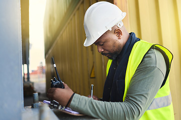 Image showing Logistics, supply chain and documents with a man shipping worker on a commercial container dock with a radio and clipboard. Stock, cargo and freight with a male courier working in the export industry