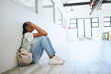 Image showing Sad, depression and anxiety student woman on floor in university campus classroom with stress for education scholarship. Depressed, burnout and tired college girl crying for fail, mistake or debt