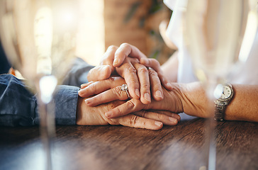 Image showing Old couple holding hands, love and support on restaurant date, retirement and care together. Closeup senior man, elderly woman and life partner with hope, trust and kindness for marriage anniversary
