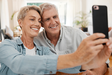 Image showing Senior couple taking selfie with phone, smile in love with 5g and technology for social media in marriage at house. Happy, married and smiling man and woman streaming, communication or video call