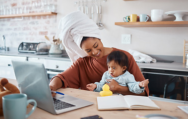 Image showing Down syndrome, baby and laptop with mother working in a kitchen, bonding and doing research on child development. Learning, freelance and disability care with remote business woman multitasking