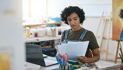 Image showing Art, documents and laptop with a woman artist in a studio, workshop or showroom while working on museum management. Manager, creative and artistic with a young female painter at work with paperwork