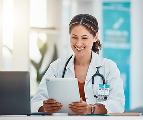 Image showing Hospital, doctor and video call on tablet with happy communication online with patient in Canada. Healthcare woman on internet with technology app for virtual consultation conversation in office.