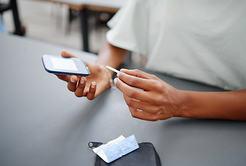 Image showing Diabetes, hands and black woman with glucometer on desk checking blood sugar levels. Healthcare, health and student learning how to use glucose meter to test insulin levels for wellness or education