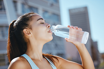 Image showing Relax, fitness and water drink girl on hydration break with outdoor summer cardio workout training. Thirsty exercise woman enjoying aqua beverage from bottle to hydrate body for health lifestyle.