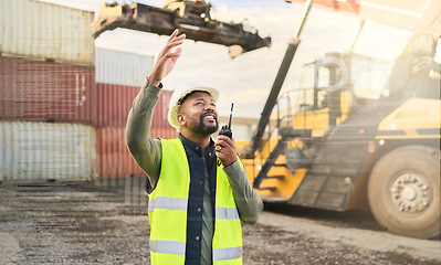 Image showing Communication, logistics and black man talking on radio working on delivery of cargo or stock at shipping port. Working on cargo delivery, transport service and supply chain industry at the container