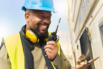 Image showing Logistics, communication and black man talking on walkie talkie working on delivery of cargo at shipping port. African industrial worker speaking on tech about stock at manufacturing warehouse