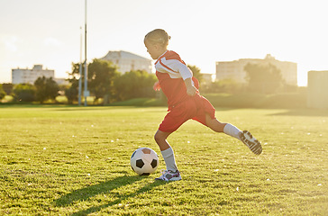 Image showing Soccer, football and sports girl training on field preparing for match, game or competition on outdoors grass pitch. Health, fitness and kid kick ball learning sport for wellness, running or exercise
