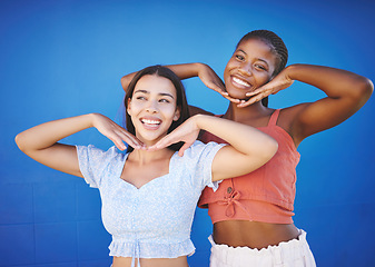 Image showing Smile, beauty and friends with smile and comic hands against a blue mockup studio background together. Portrait and thinking face of black woman and girl being happy and funny with a gesture