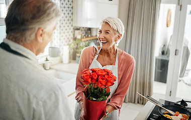 Image showing Flowers, love and cooking with a senior couple in a kitchen forsurprise breakfast in celebration of an anniversary, birthday or valentines day. Food, romance and morning with an elderly man and woman