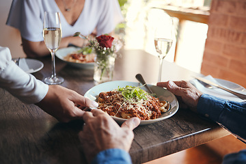 Image showing Food service, wine and couple at table with hospitality from waiter at restaurant for lunch. Cafe worker with plate of pasta for man and woman on date for anniversary or marriage at fine dining cafe