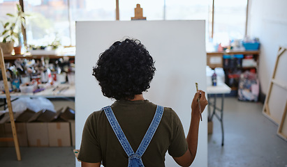 Image showing Painting artist, blank canvas and creative woman thinking of inspiration in studio workshop or art class. Creativity, drawing or sketch painter girl busy or ready to start on artwork project on easel