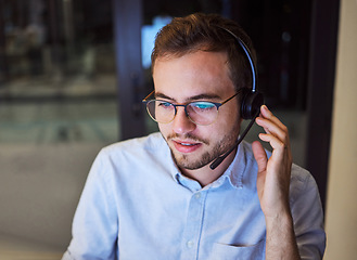 Image showing Call center, customer service and telemarketing with a man working in support with a headset in his office. Sales, consulting and contact us with a male consultant at work in crm communication